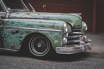 Vintage Green Rat Rod Car with Rust and Chrome Details