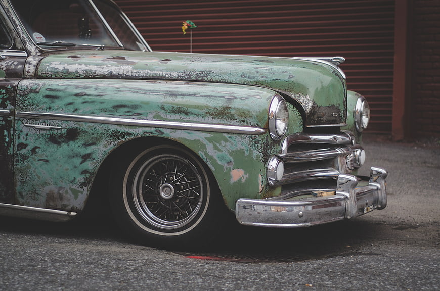 Vintage Green Rat Rod Car with Rust and Chrome Details