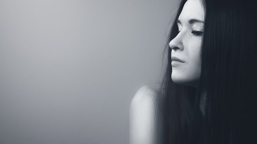 Moody Black and White Portrait of Woman with Eyes Closed