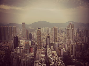Aerial View of Hong Kong Cityscape with Skyscrapers and Mountains