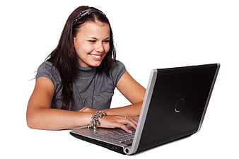 Smiling Young Woman Using Laptop on White Background