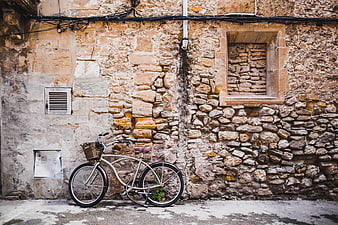 Vintage Bicycle Leaning Against Old Stone Wall