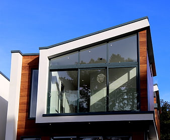 Modern House with Wood Siding and Large Glass Windows