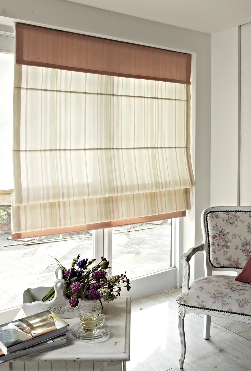 Elegant striped roman blind in bright shabby chic interior