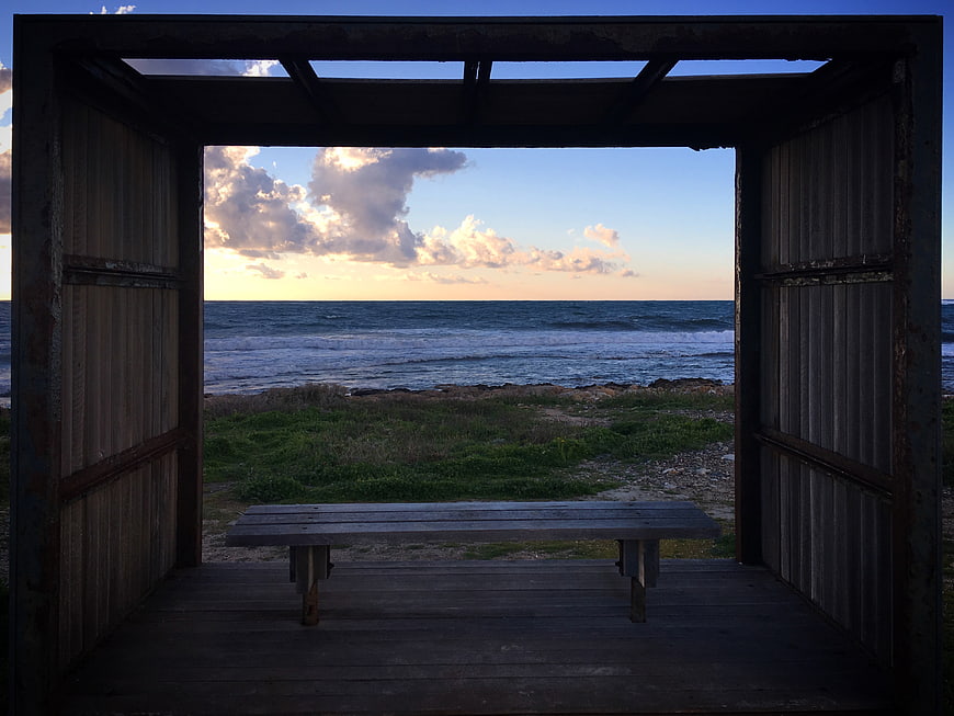 Wooden Shelter Framing Ocean Sunset View