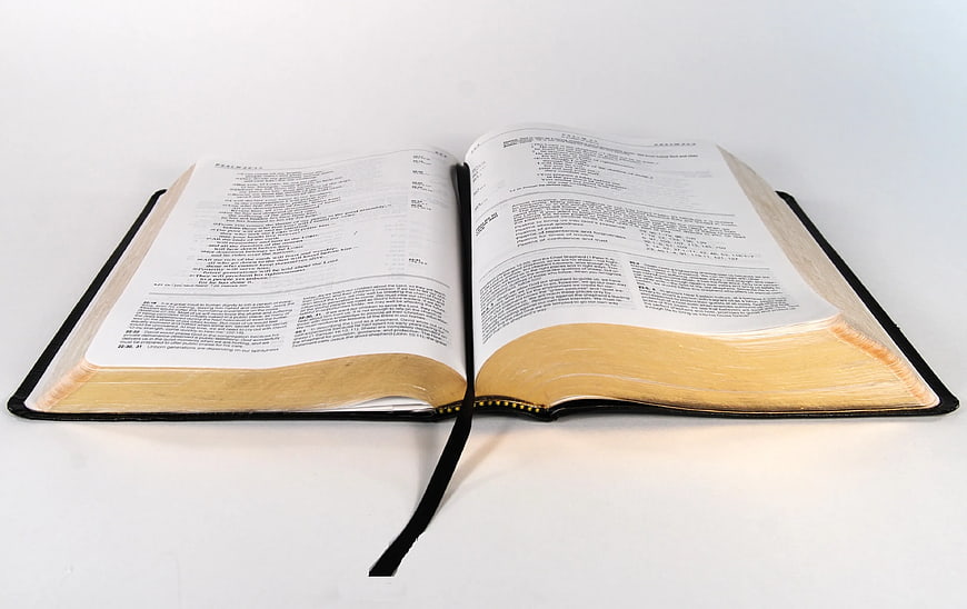Open Bible on White Background with Ribbon Bookmark
