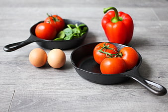 Fresh Vegetables and Eggs in Cast Iron Skillets