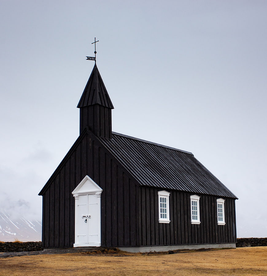 Black Icelandic Church With White Door And Steeple