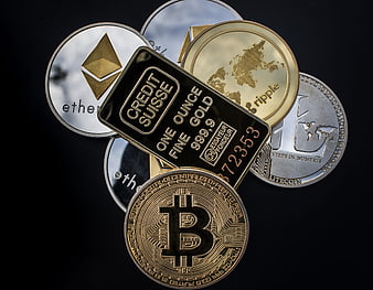 Physical Cryptocurrency Coins And Gold Bar On Black Background