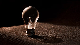 Vintage Light Bulb on Textured Surface