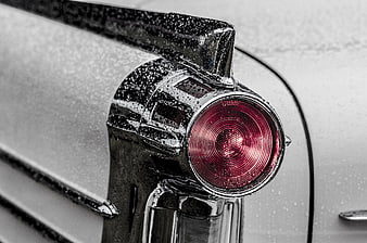 Close-up of vintage car tail light with raindrops