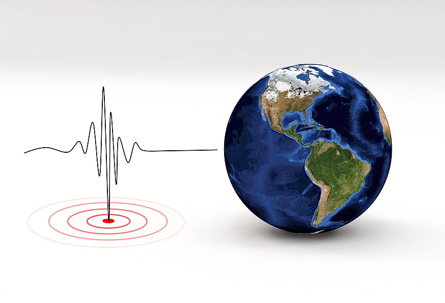 Seismograph Wave Diagram Next to 3D Earth Globe
