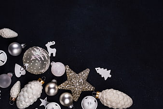 Silver and White Christmas Ornaments on Black Background