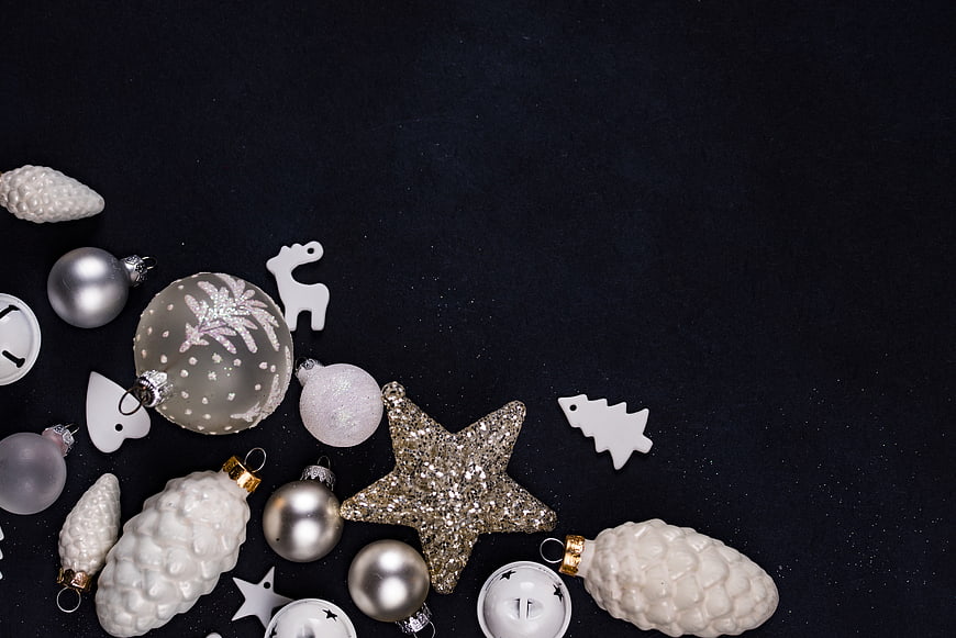 Silver and White Christmas Ornaments on Black Background