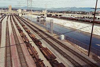 High Angle View of Train Tracks and River Channel
