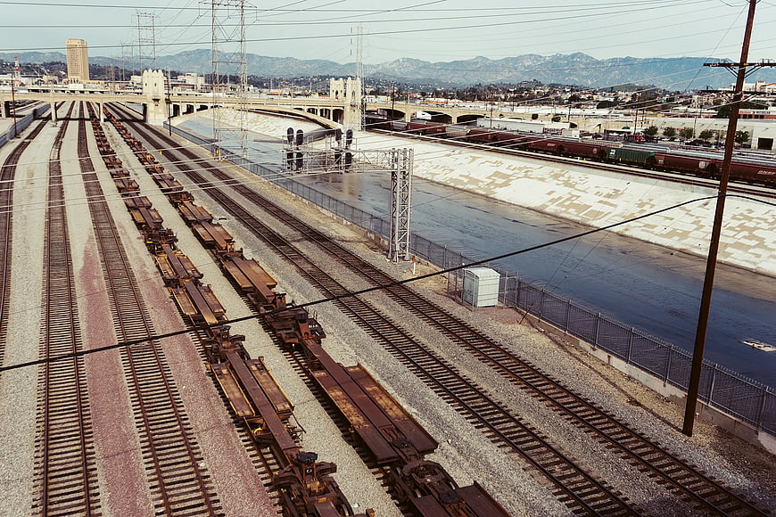 High Angle View of Train Tracks and River Channel