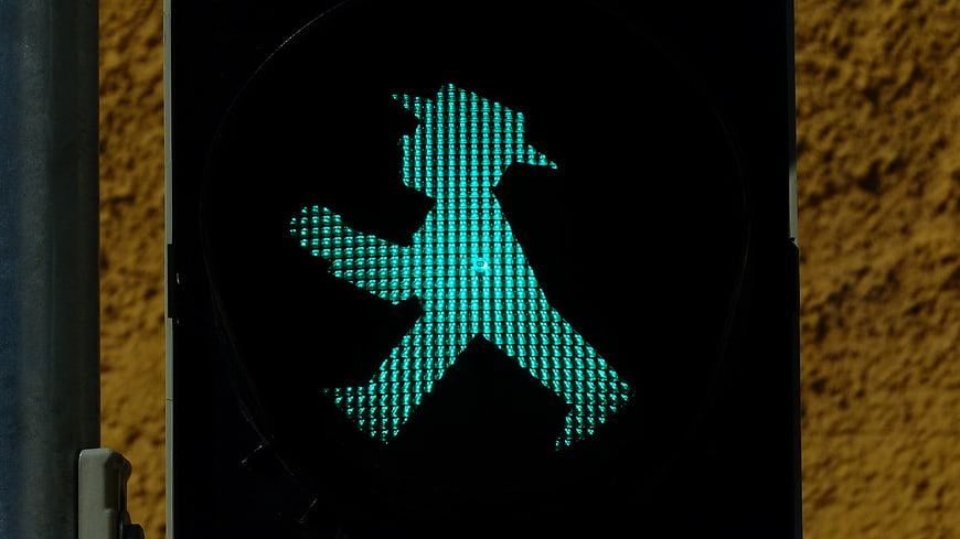 Green pedestrian traffic light with East German man silhouette
