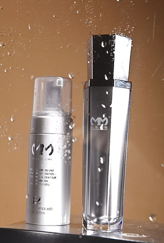 Silver Skincare Bottles with Water Droplets