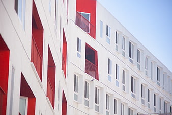 Modern White and Red Apartment Building Facade