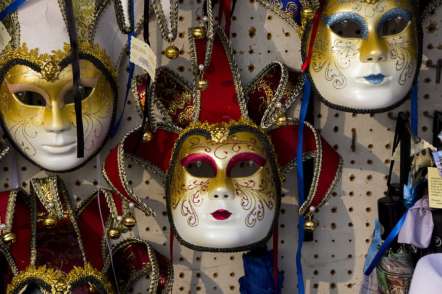 Colorful Venetian Carnival Masks Hanging on Display