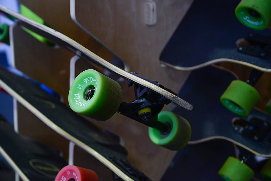 Close-up of Skateboard Wheels and Trucks on Display Rack