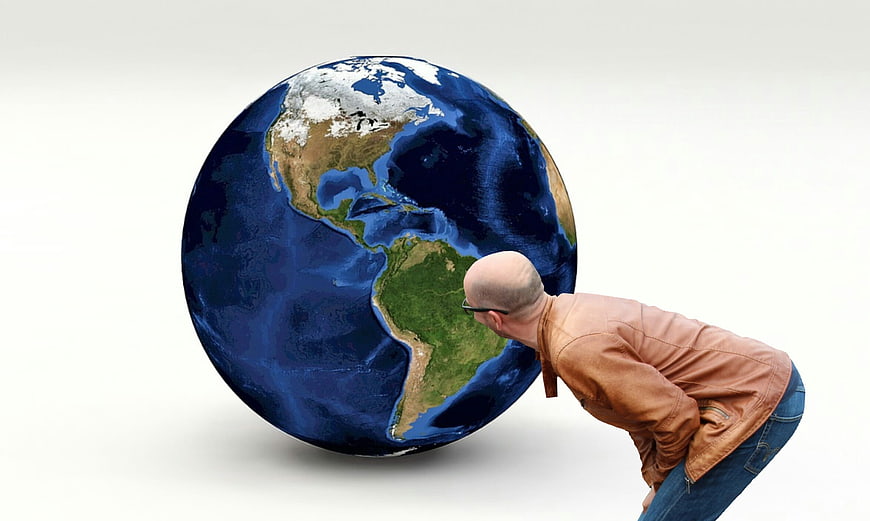 Man Pushing Giant Earth Globe Concept