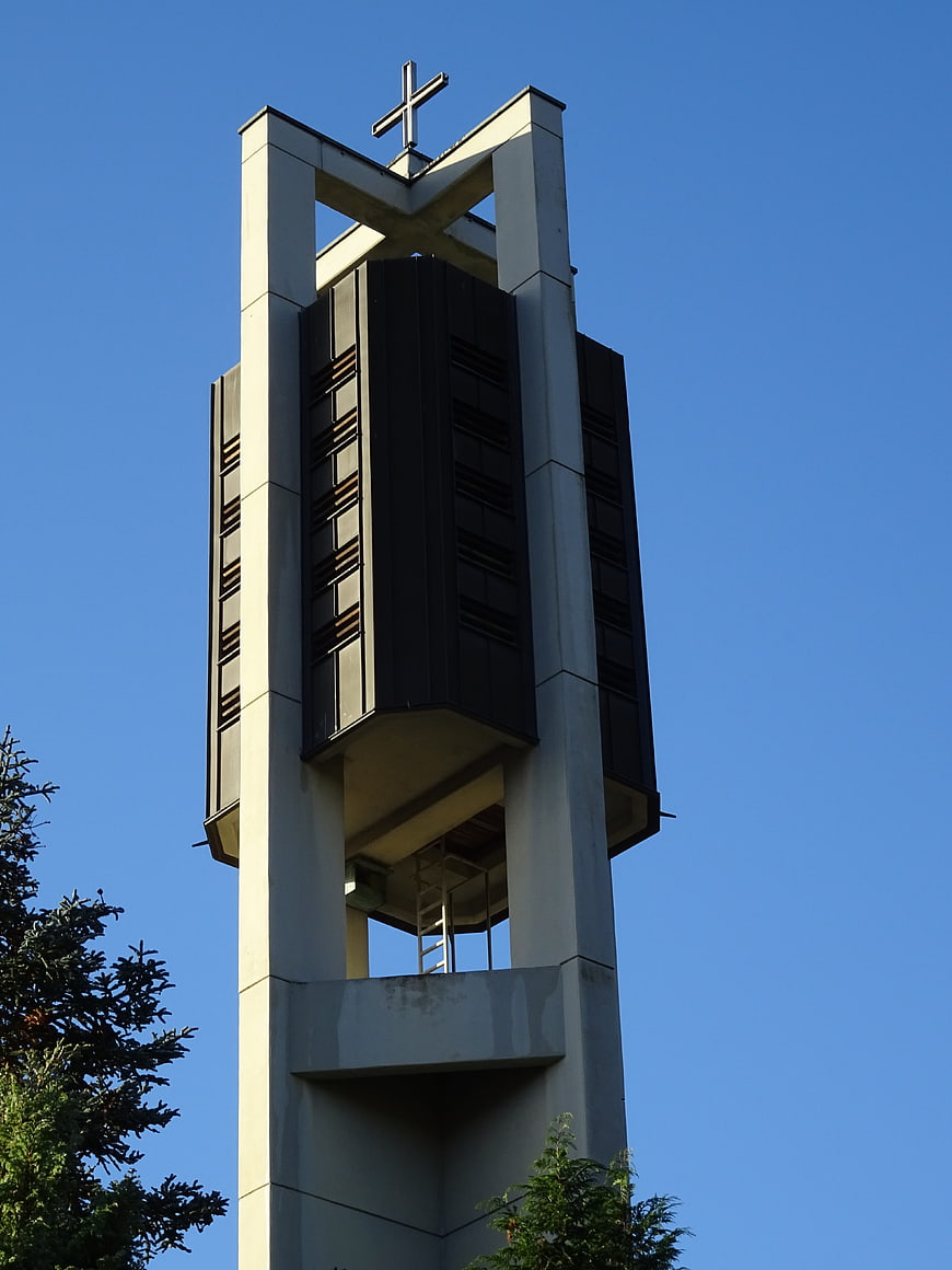 Modern church bell tower against blue sky
