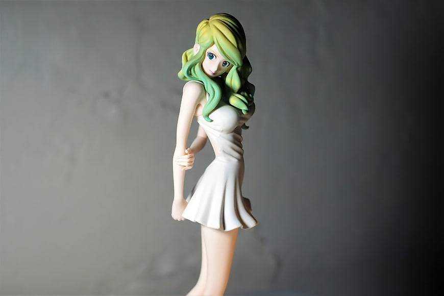 Anime Figurine of Woman in White Dress with Green Hair