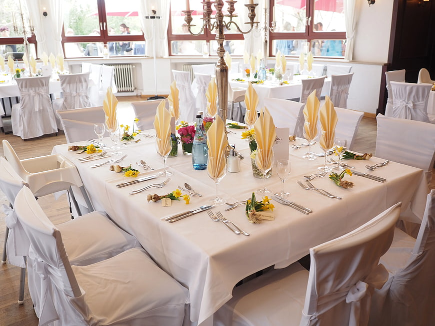 Elegant Wedding Reception Table Setting with Yellow Napkins