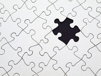 White jigsaw puzzle with missing piece hole