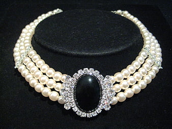 Elegant Triple Strand Pearl Necklace with Black Onyx Centerpiece