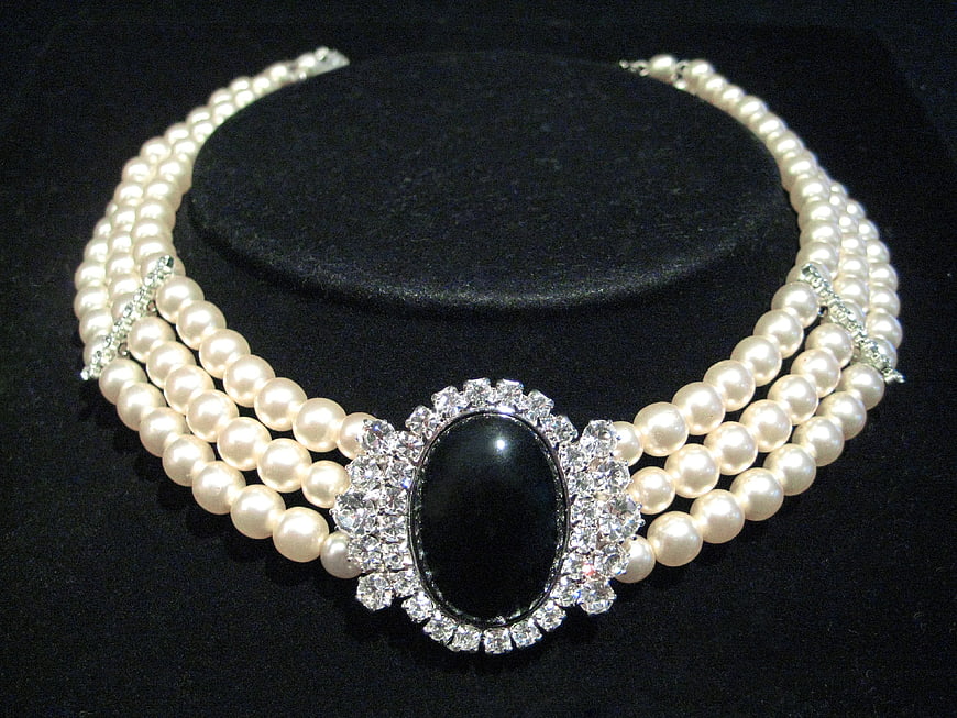 Elegant Triple Strand Pearl Necklace with Black Onyx Centerpiece