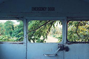 Vintage Emergency Door on Abandoned Vehicle with Rusty Details