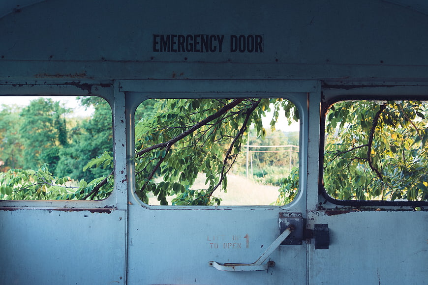Vintage Emergency Door on Abandoned Vehicle with Rusty Details