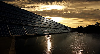 Floating Solar Panels on Lake at Golden Hour