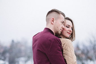 Romantic Couple Hugging in Winter Landscape