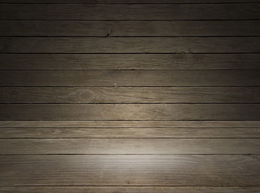 Dark rustic wooden plank background with dramatic spotlight effect