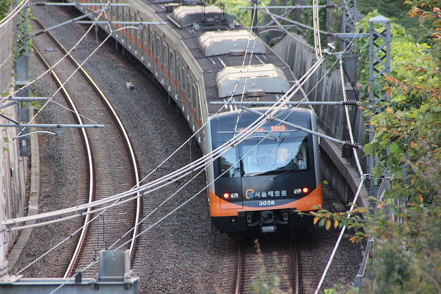 Seoul Metro Train 3038 Navigating Curved Urban Railway Tracks