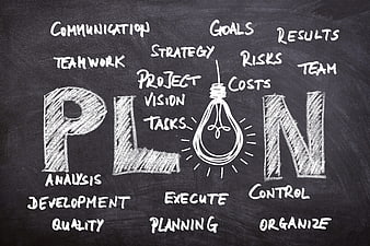 Business Planning Concept Chalkboard with Strategy Keywords and Lightbulb