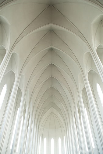 White Gothic Vaulted Ceiling with Arches and Sunlight