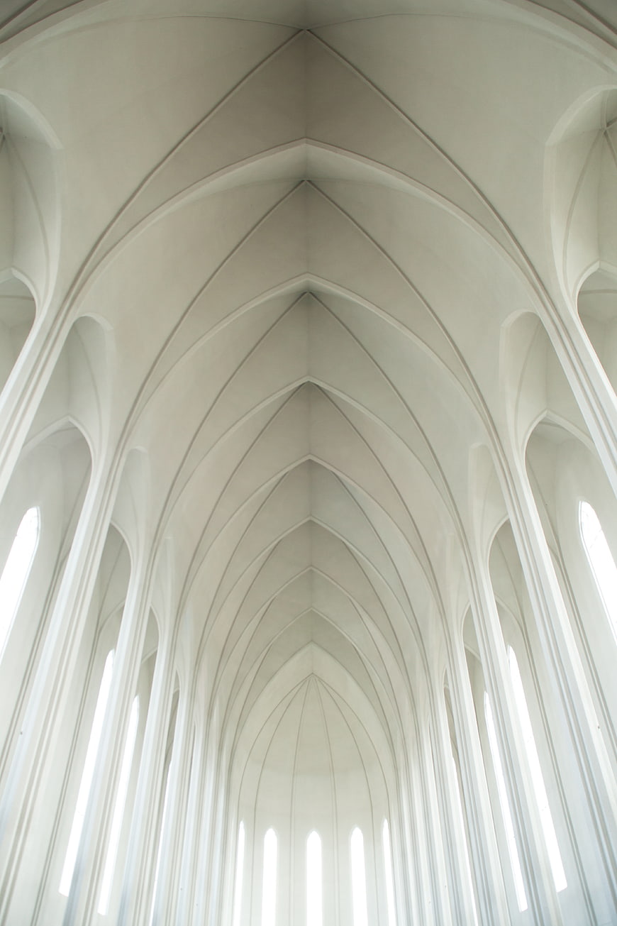 White Gothic Vaulted Ceiling with Arches and Sunlight