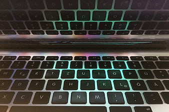 Close-up of MacBook Keyboard with Screen Reflection