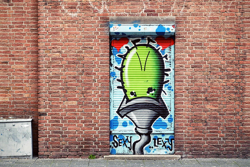 Colorful Spray Paint Graffiti Mural on Brick Wall