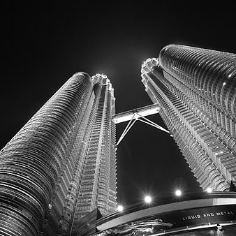 Black and white low angle view of Petronas Towers at night