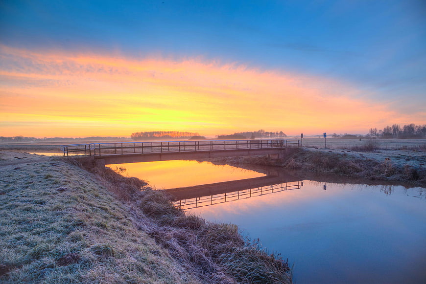 Frosty Bridge Over Canal at Golden Sunrise