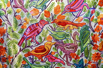 Colorful Embroidered Birds and Floral Pattern on Fabric