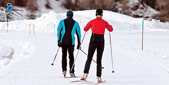 Two Cross-Country Skiers on Snowy Winter Trail