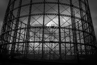 Black and white industrial gas holder steel structure
