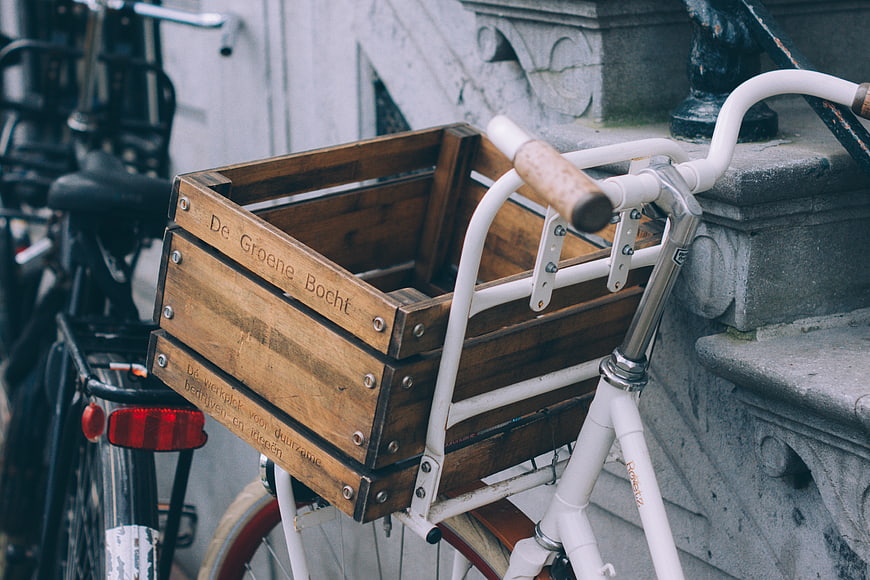 White Bicycle with Wooden Crate Basket on Urban Street