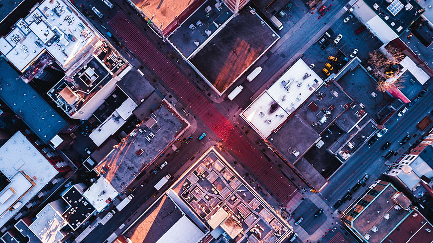 Aerial View of Urban City Intersection with Rooftops